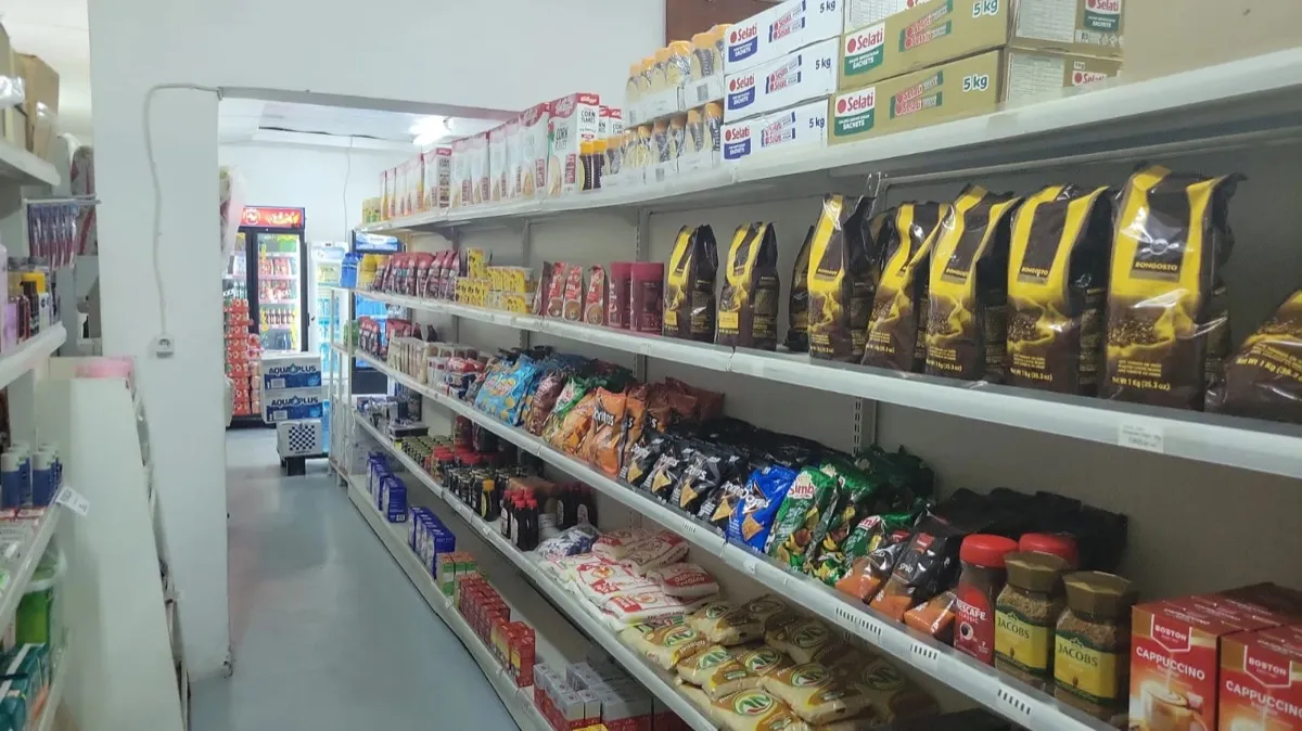 Shelves with coffee, snacks, cereals and sugar
